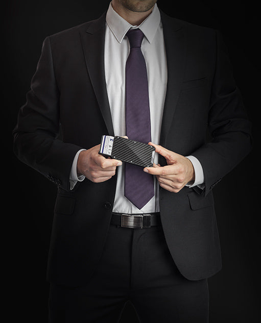Vanacci Stealth 3 wallet with shiny carbon fiber held by a man