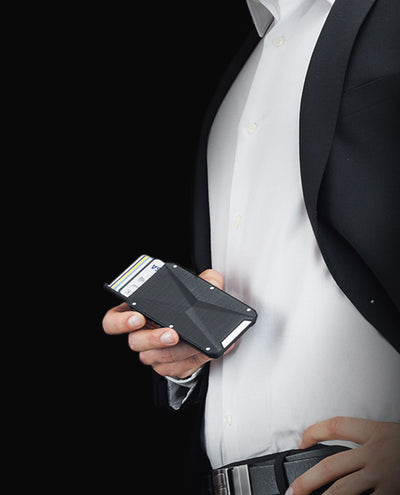 Vanacci Stealth 3 wallet held by a man in smart attire.